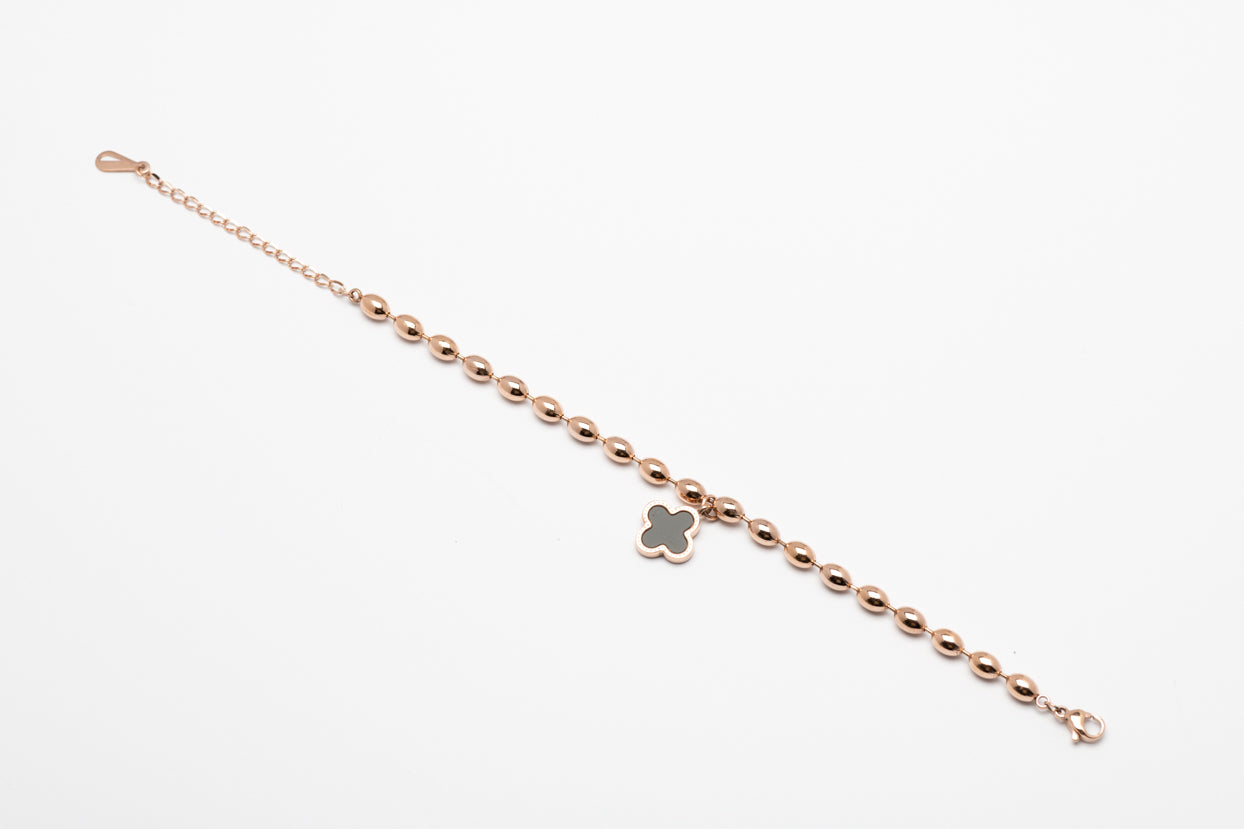 Stainless steel rose gold oval beads with black flower pendent