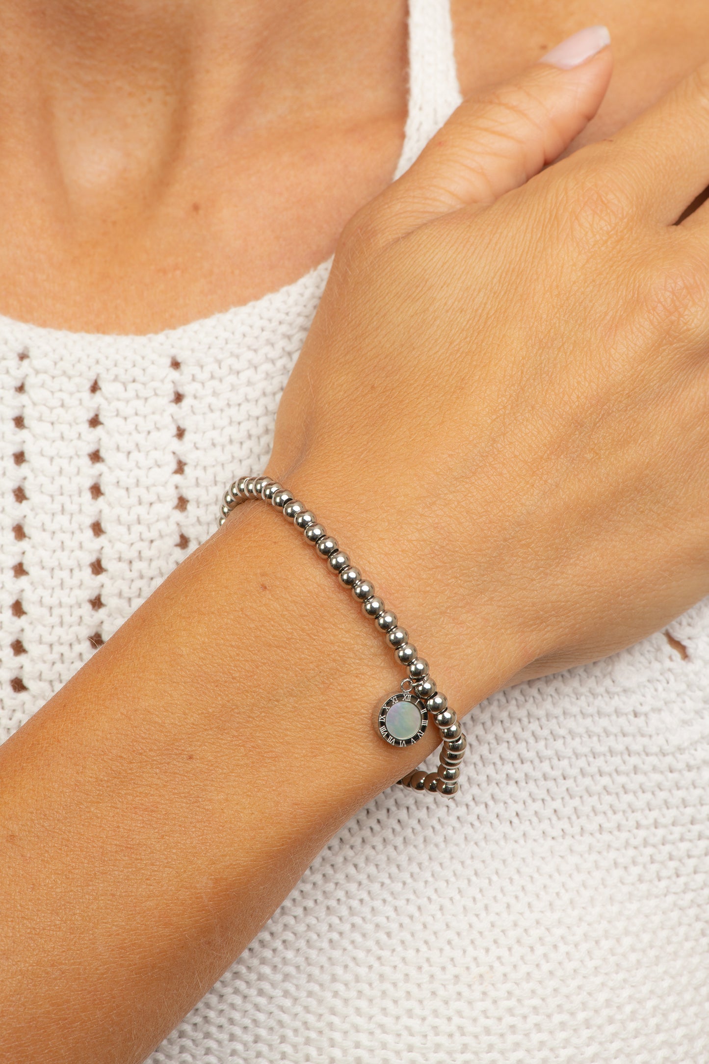 Stainless steel gold tone bracelet with black and white circles