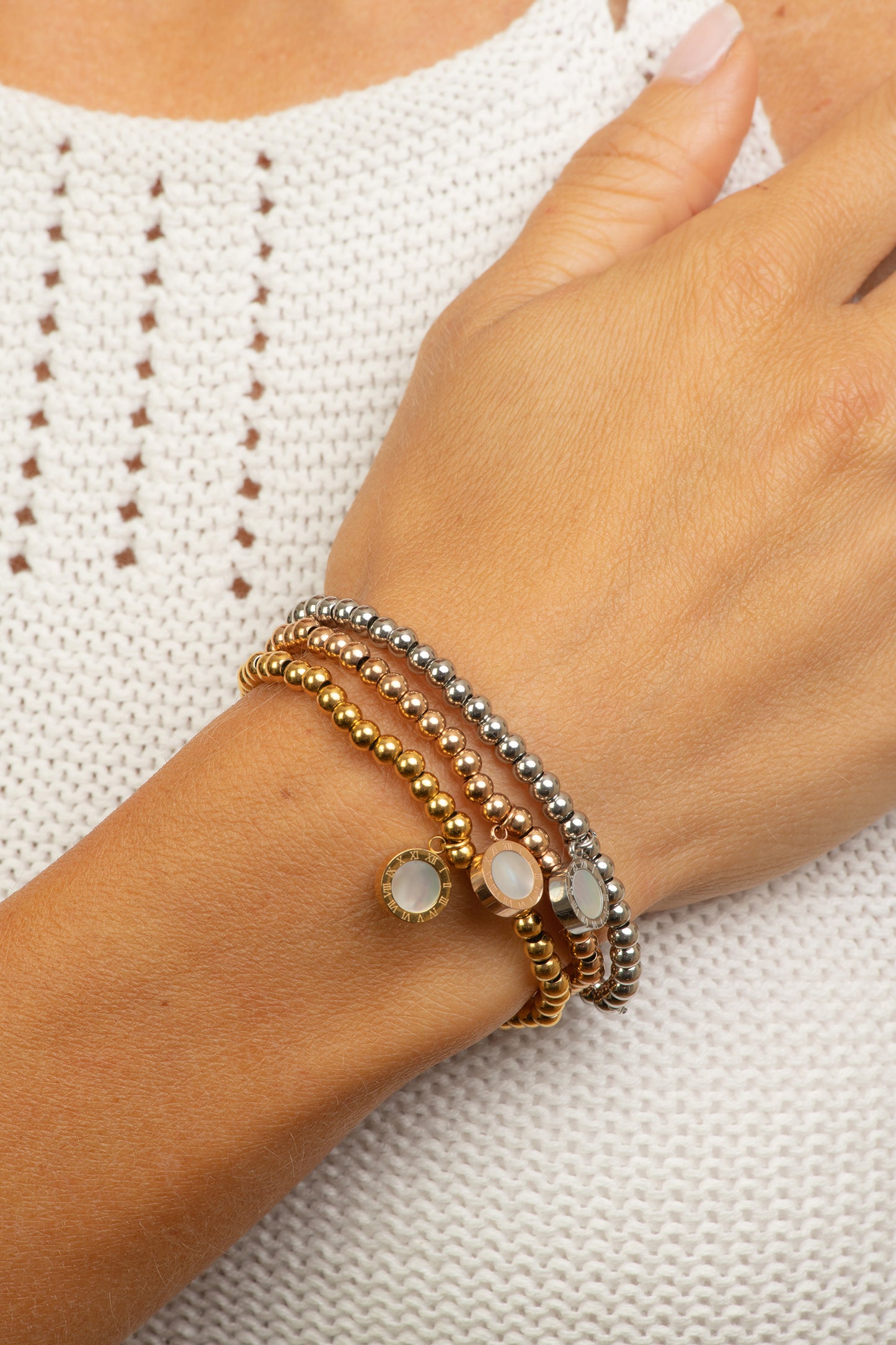 Stainless steel gold tone bracelet with black and white circles