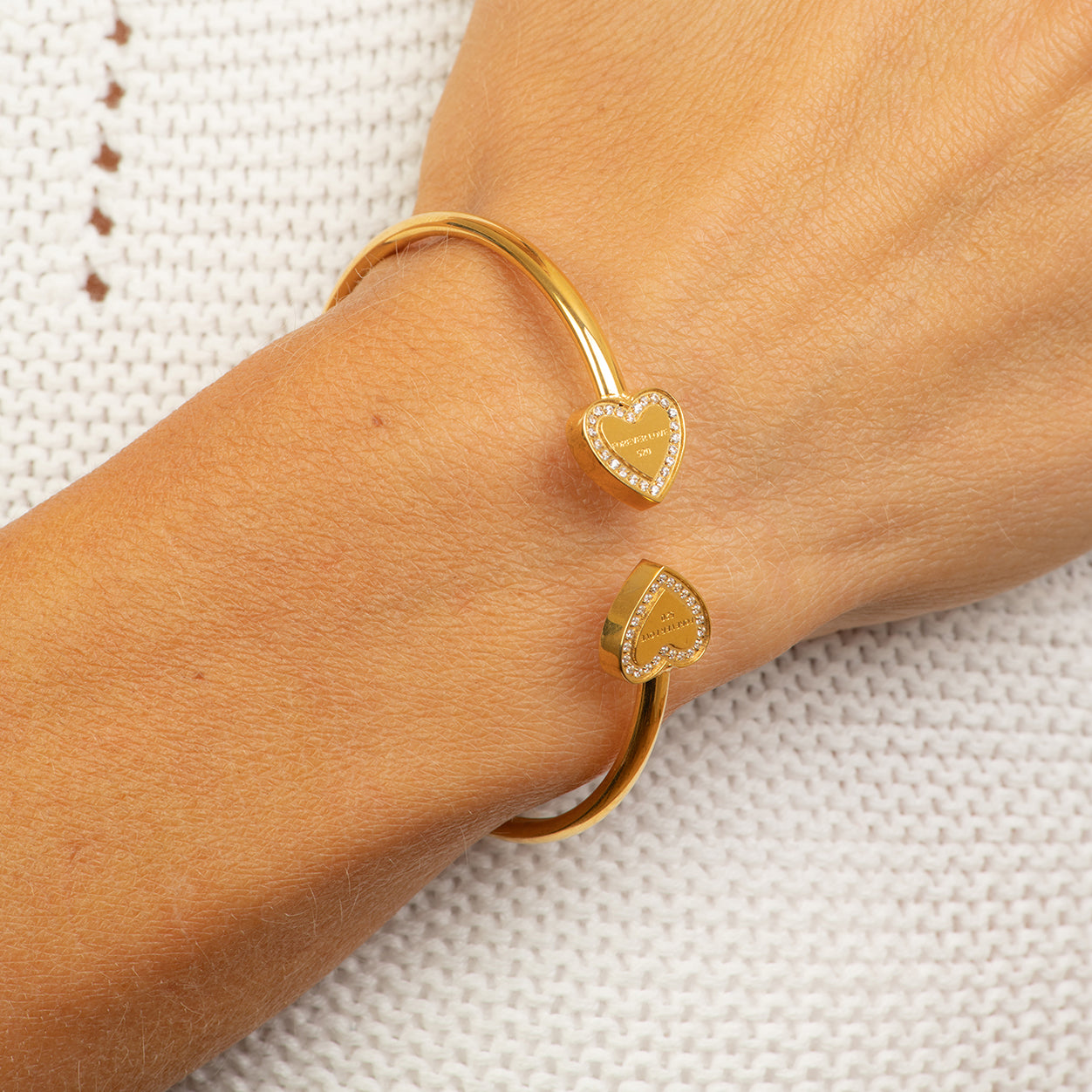 Stainless steel rose gold bangle with 2 hearts