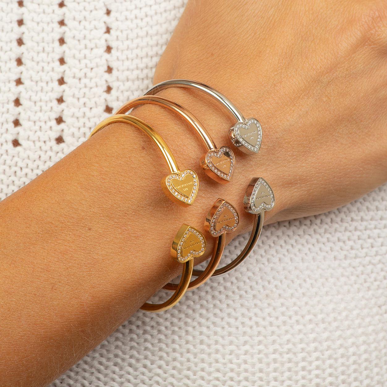 Stainless steel rose gold bangle with 2 hearts