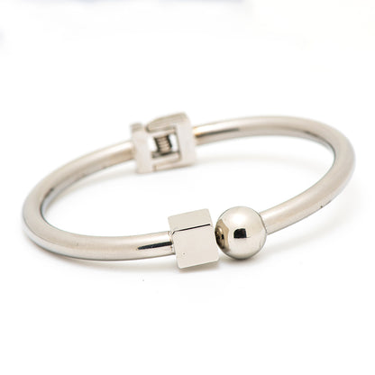 stainless steel bangle with a square and circle shapes